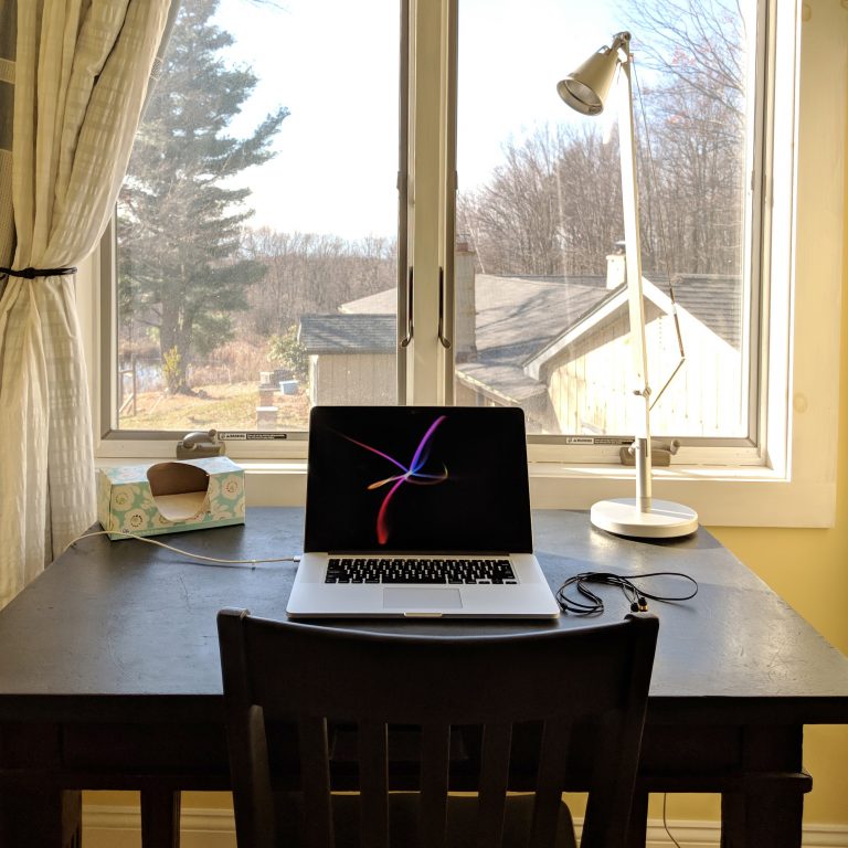 A focused workstation overlooking a small family farm in Ghent, New York
