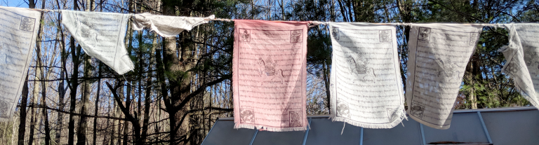 Prayer flags fly over the farm