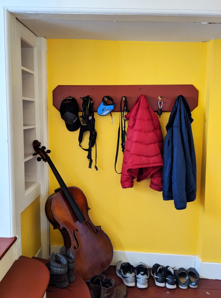 coats and shoes in doorway