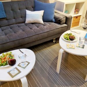 dinner on two coffee tables in front of couch