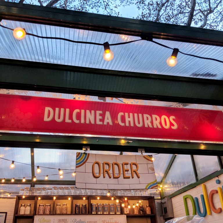 a holiday churros stand in bryant park