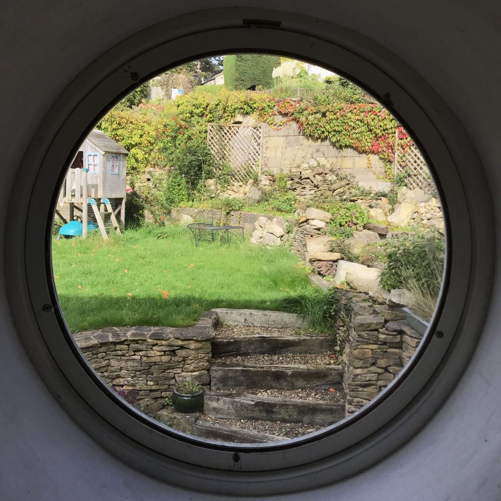 Circular window looking upon garden