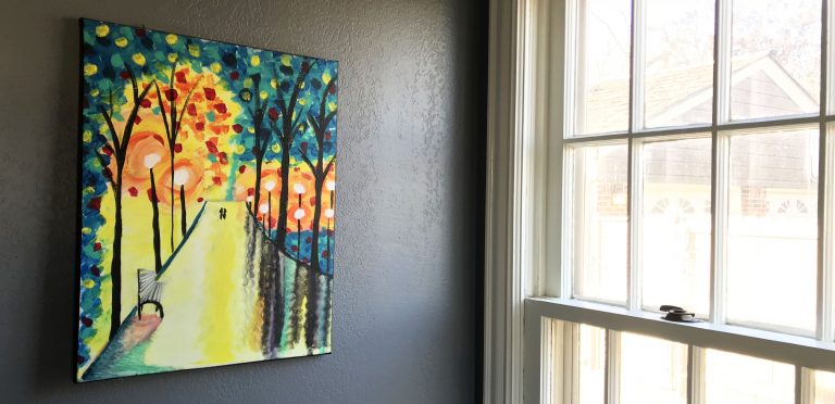 colorful painting next to a bright window