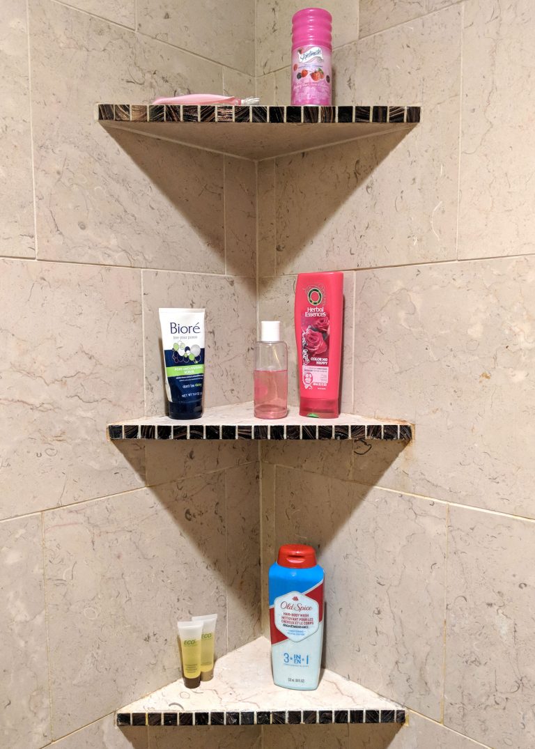 three shelves inside a shower