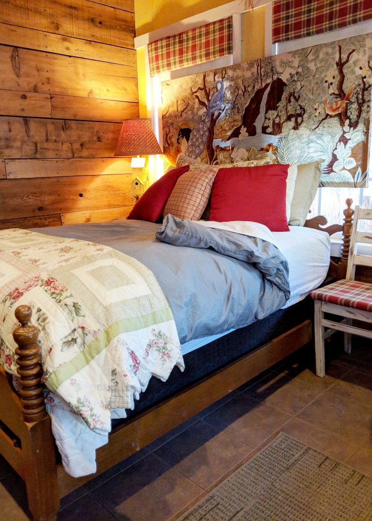comfy bed in cabin in the woods