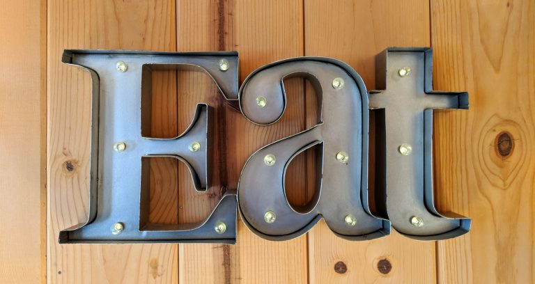 metal "Eat" sign with lights