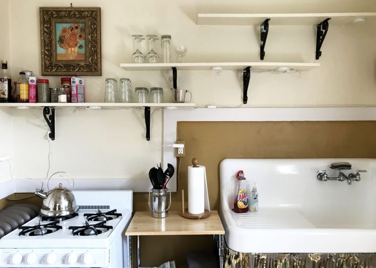 kitchen shelves with rustic farm sink