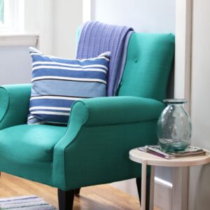 teal chair with blue cushions