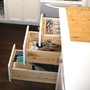 kitchen island with cutting board and drawers