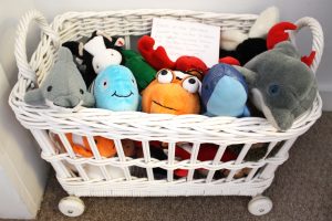 basket of stuffed animals for kids