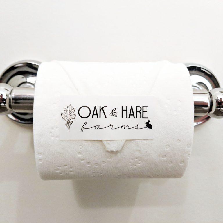 Branded sticker on toilet paper roll in Tennessee Airbnb
