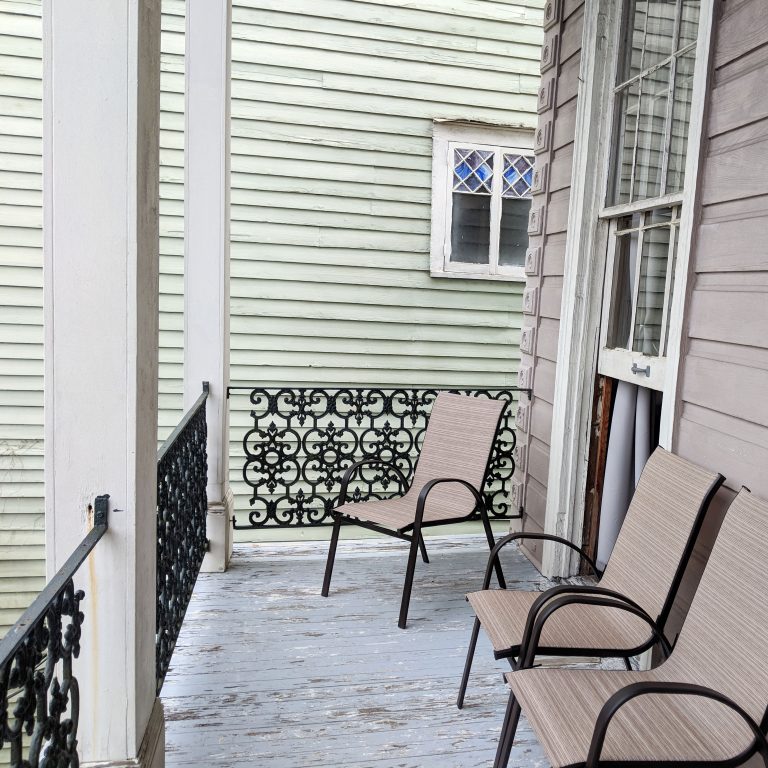 upper porch with chairs in New Orleans Airbnb