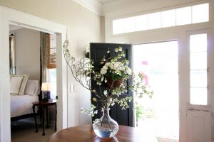 Airbnb photos with entry way flowers